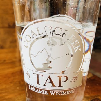 Coal Creek Tap - a glass of water on a table - Breweries Near Me - Laramie, Wyoming Coal Creek Tap - a glass of water on a table - Breweries Near Me - Laramie, Wyoming