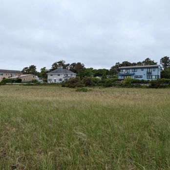 Pine Point Beach - View from entryway to the beach, looking back at the houses along the coast. Entered from 9th Street, Scarborough, Maine 04074. - Beaches Near Me