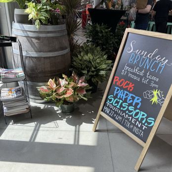 Frost Town Brewing - A frame sign and magazine rack - Brewpubs Near Me - Houston, Texas