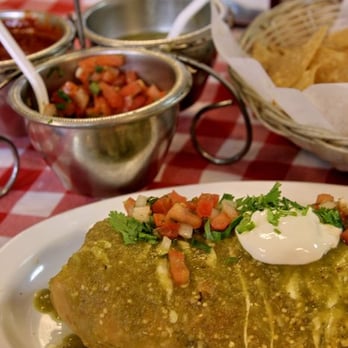 Las Parrillas Restaurant - Trying to give a scale of the size of the chimichanga using the napkin holder and spoons. - Mexican Near Me - Menlo Park, California Las Parrillas Restaurant - Trying to give a scale of the size of the chimichanga using the napkin holder and spoons. - Mexican Near Me - Menlo Park, California