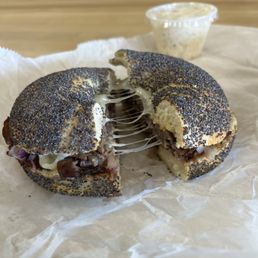 Fancy French Dip Sandwich with a poppy bagel