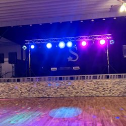 Rebirth Entertainment - A fully illuminated photo of our truss LED dance lighting when we did Wahoo High School's Prom in 2021 at Starlite Event Center in Wahoo NE!
