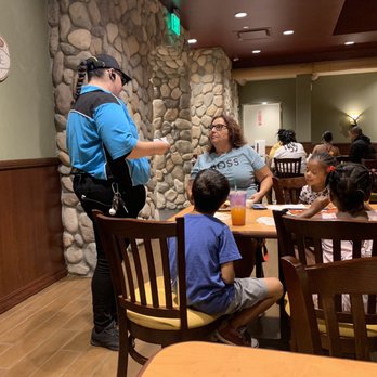 John's Incredible Pizza - Carson - Lena explaining the procedures to patrons in the cabin fever dining room; how to get going and how to enjoy the game side while eating - Arcades Near Me - Carson, California