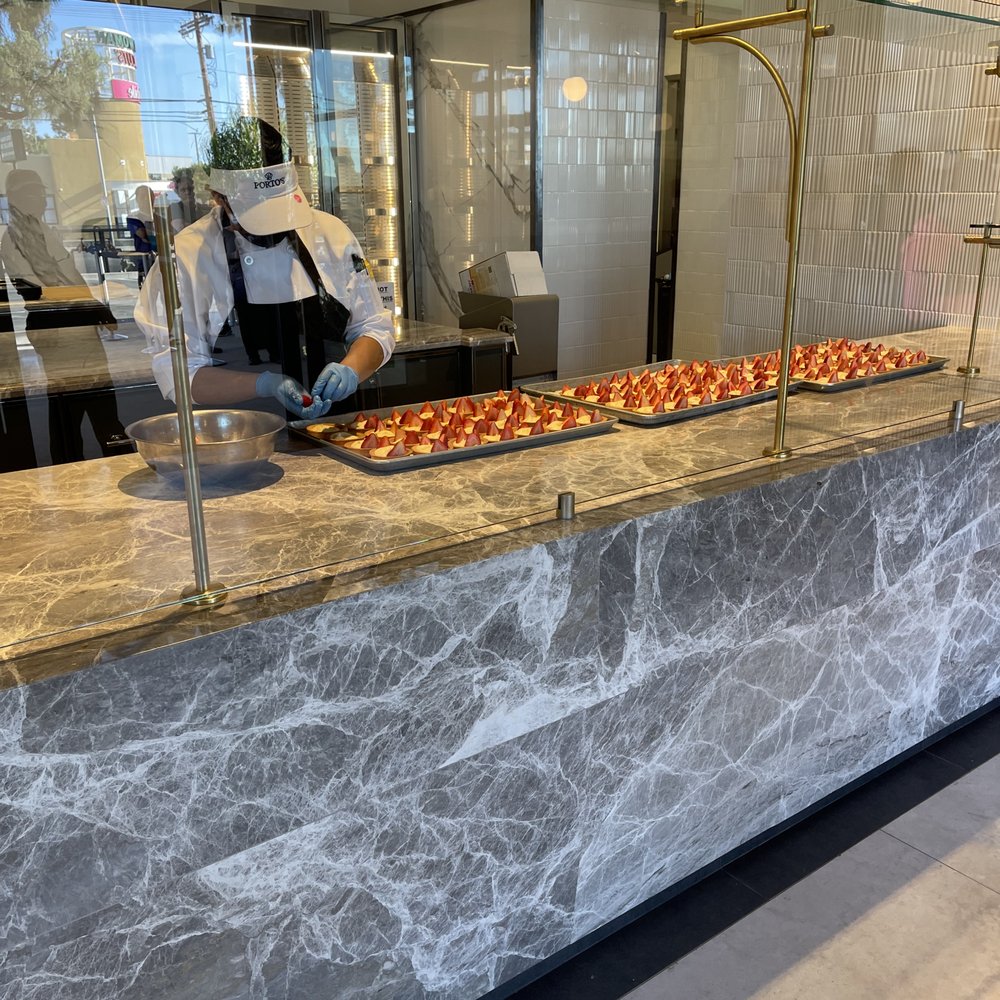 Porto's Bakery and Cafe - As you enter, an open assembly station - Bakeries Near Me - Northridge, California Porto's Bakery and Cafe - As you enter, an open assembly station - Bakeries Near Me - Northridge, California