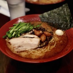 Photo of Ramen Dojo - San Mateo, CA, United States. Garlic Pork Flavor Ramen, served with roasted pork, fried whole garlic, kikurage mushroom, quail egg, and green chives.