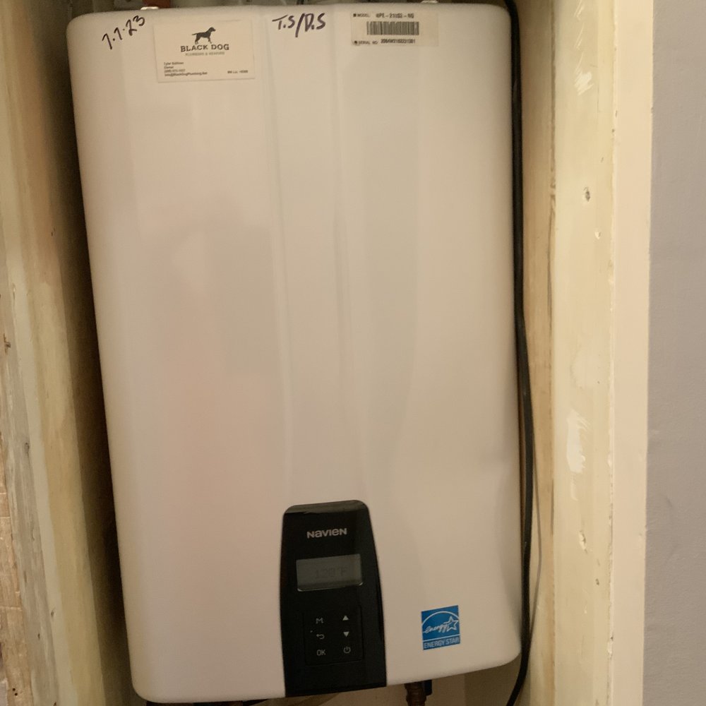 Black Dog Plumbing & Heating - Tankless water heater installed in small closet. - Plumbing Near Me - Framingham, Massachusetts Black Dog Plumbing & Heating - Tankless water heater installed in small closet. - Plumbing Near Me - Framingham, Massachusetts