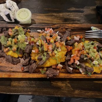 Aguardiente - Tostones con entraña- salsa es cilantro molido - Steakhouses Near Me - Orlando, Florida