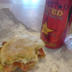 The Oasis - Breakfast sandwich with (egg, bacon, & cheese) with tomato, and a pomegranate Rockstar