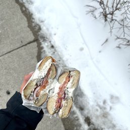 a person holding a sandwich a person holding a sandwich