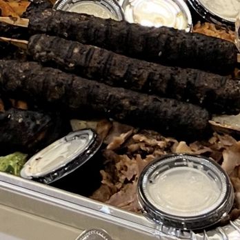 Zeus - Very burnt mixed grill. They look like black logs. - Greek Near Me - Roswell, Georgia