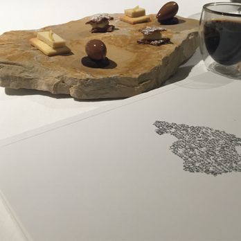 Bistró del Jardín - No this isn't the Game of Thrones intro, it's our dessert, some "coffee" made from figs, and our menu booklet - Signature Cuisine Near Me - Alcúdia, PM