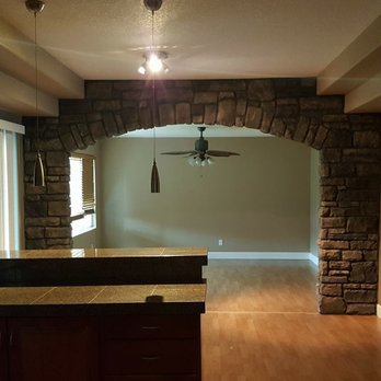 Cravenho Construction & Building - a kitchen and living room - General Contractors Near Me