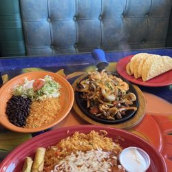 El Rodeo - Pepe's Combo (Taquitos and enchiladas) and Fajitas Texanas (steak, shrimp, and chicken)