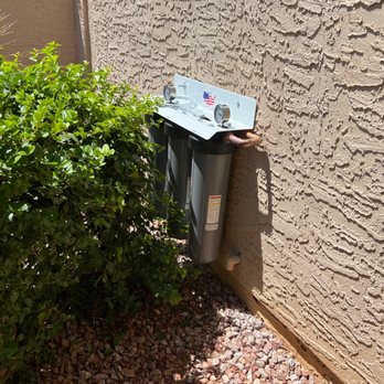 Puragain Water - The outside system is installed pretty much completely out of view and safely behind a bush. - Water Purification Services Near Me - Phoenix, Arizona Puragain Water - The outside system is installed pretty much completely out of view and safely behind a bush. - Water Purification Services Near Me - Phoenix, Arizona