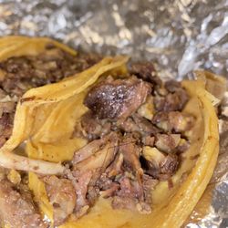 Taco Station - Tacos de Cabeza featuring a thick strand of hair