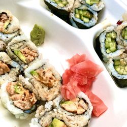 Arigatou Japanese Food to Go - Cooked salmon and avocado roll (green caterpillar) and cucumber (kappa) roll.