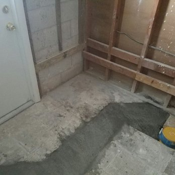 Drain Wizard Plumbing & Rooter Services - concrete work in guest bathroom - Water Heater Installation/Repair Near Me - Cocoa, Florida