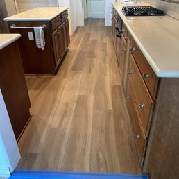 Excellent job pairing this LVP with existing cherry cabinets. Excellent job pairing this LVP with existing cherry cabinets.