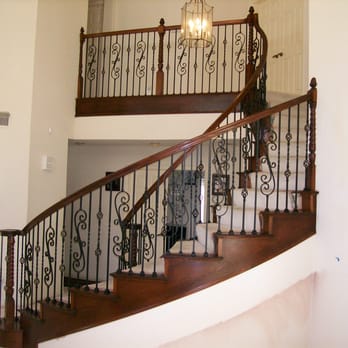 Stairs By Design - Elegant curved stair custom made of hardwood maple with factory powder-coated satin black wrougt iron balusters. - General Contractors Near Me - Vista, California Stairs By Design - Elegant curved stair custom made of hardwood maple with factory powder-coated satin black wrougt iron balusters. - General Contractors Near Me - Vista, California