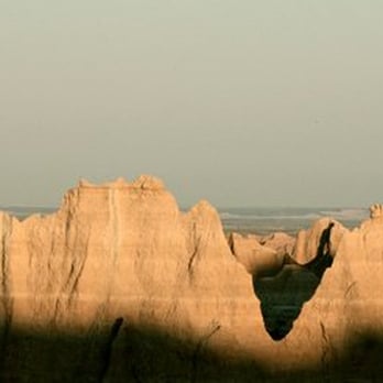 Badlands National Park - July 2009: Sun rising in the Badlands - Parks Near Me - Interior, South Dakota Badlands National Park - July 2009: Sun rising in the Badlands - Parks Near Me - Interior, South Dakota