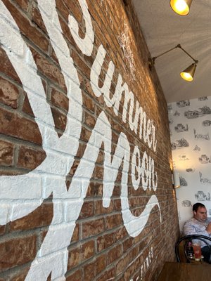 Photo of Summer Moon Coffee - Austin, TX, US. The brick wall that makes you smarter