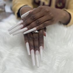 L A Nail - Extremely long nails with off white powder.
