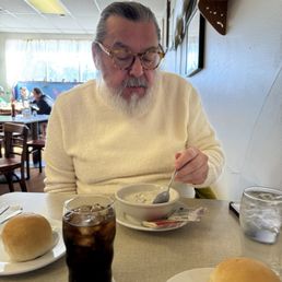 Celebrity yelper Jeffrey R (dressed to coordinate with the soup) enjoying a bowl of clam chowder. Celebrity yelper Jeffrey R (dressed to coordinate with the soup) enjoying a bowl of clam chowder.