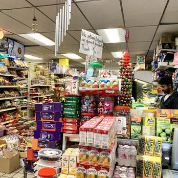 Taj Mahal Desi Bazaar - a woman in a store - Convenience Stores Near Me - Somerville, Massachusetts Taj Mahal Desi Bazaar - a woman in a store - Convenience Stores Near Me - Somerville, Massachusetts