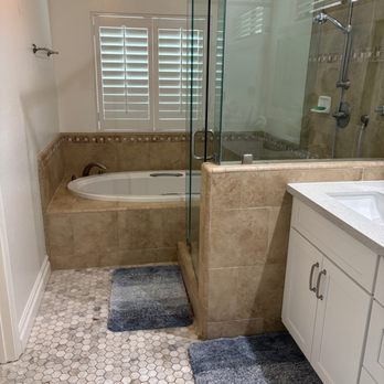 Manifest Construction  - Bought home with a tub and shower pushed to the end. Older style tile. - General Contractors Near Me