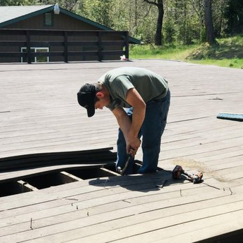Cornerstone Construction & Tree Service - a man working on a deck - General Contractors Near Me - Grants Pass, Oregon