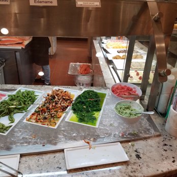 Four Seasons Buffet - I wonder how long the salmon sits there unrefrigerated by the floor before finally being served?! - Buffets Near Me - Cerritos, California