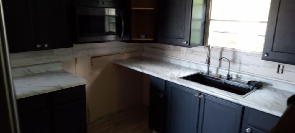 Slide of Hardwick Remodeling and Home House Cleaning Crew