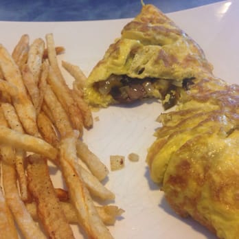 Flying With Jerome - Three egg omelette with bell peppers, onions, mushrooms, and with a side of french fries. - Breakfast & Brunch Near Me - Clearwater, Florida Flying With Jerome - Three egg omelette with bell peppers, onions, mushrooms, and with a side of french fries. - Breakfast & Brunch Near Me - Clearwater, Florida