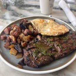 New York strip, fried eggs, potatoes