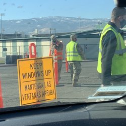 Washoe County Health District - Camo guy w/orange vest pulling up his mask wasn't wearing it at first. He put it on after seeing me looking at him.