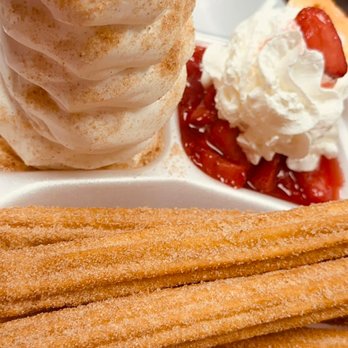 Roger's Place - a stack of churrons with whipped cream and strawberries - Ice Cream & Frozen Yogurt Near Me - Chicopee, Massachusetts Roger's Place - a stack of churrons with whipped cream and strawberries - Ice Cream & Frozen Yogurt Near Me - Chicopee, Massachusetts