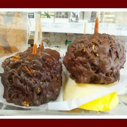 Cunis Candies Inc - Turtle Caramel Apples - Apple dipped in Homemade Caramel, rolled in Roasted & Salted Pecans, and drizzled with Pure Milk or Dark Chocolate!