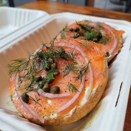 Plain bagel with smoked salmon, dill, capers, cream cheese, and red onion Plain bagel with smoked salmon, dill, capers, cream cheese, and red onion