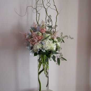 Lilium Floral Design - Ceremony arrangements ~ white hydrangeas, pink Astilbe, eucalyptus, dusty miller, pink stock, and curly willow branches. Love the design. - Florists Near Me - Colleyville, Texas Lilium Floral Design - Ceremony arrangements ~ white hydrangeas, pink Astilbe, eucalyptus, dusty miller, pink stock, and curly willow branches. Love the design. - Florists Near Me - Colleyville, Texas