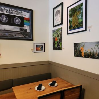 Harvest Bar + Kitchen - a table with two shoes on it - Pizza Near Me - Columbus, Ohio