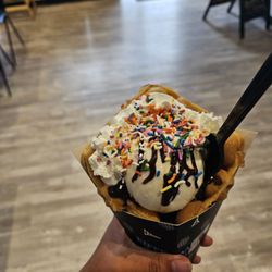 Eiffel Waffle Creamery - This is vanilla ice cream with hot fudge, whip cream and sprinkles in a bubble waffle.