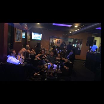 Ramsey's Hookah Lounge - a group of people sitting around a table - Hookah Bars Near Me - Buffalo, New York