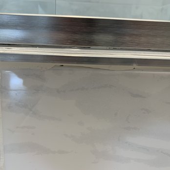 Dryfix Services - outside shower door (bottom) - bad caulk/grout job - Damage Restoration Near Me - Chula Vista, California