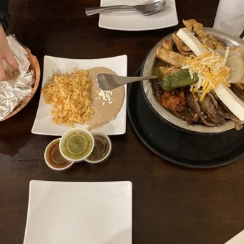 Los Molcajetes - a table full of mexican food - Mexican Near Me - West Valley City, Utah Los Molcajetes - a table full of mexican food - Mexican Near Me - West Valley City, Utah