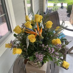 H-E-B - 16 yellow roses, 1 bird of paradise, greens and baby breath. Plus a vase. $145.