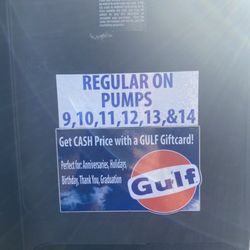 Fat dogs - Sign Indicating regular gas is on pumps nine through 14
