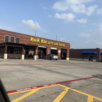 Kwik Kar Auto Repair - One car being serviced and 6 employees standing around. - Auto Repair Near Me - Little Elm, Texas Kwik Kar Auto Repair - One car being serviced and 6 employees standing around. - Auto Repair Near Me - Little Elm, Texas