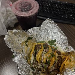 Seafood & Tacos Raul - Two Al pastor two asada tacos with Jamaica water.