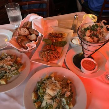 Cafe Bizou - Our delicious appetizers: Caesar Salads, Tomato Bruschetta, Fried Calamari, and the complimentary bread basket. - French Near Me - Agoura Hills, California