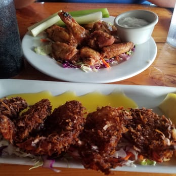 Lulu's Waikiki - Above Thai chicken wings and the coconut shrimp on the bottom.. both were good, but the coconut shrimp was the best - Burgers Near Me - Honolulu, Hawaii Lulu's Waikiki - Above Thai chicken wings and the coconut shrimp on the bottom.. both were good, but the coconut shrimp was the best - Burgers Near Me - Honolulu, Hawaii
